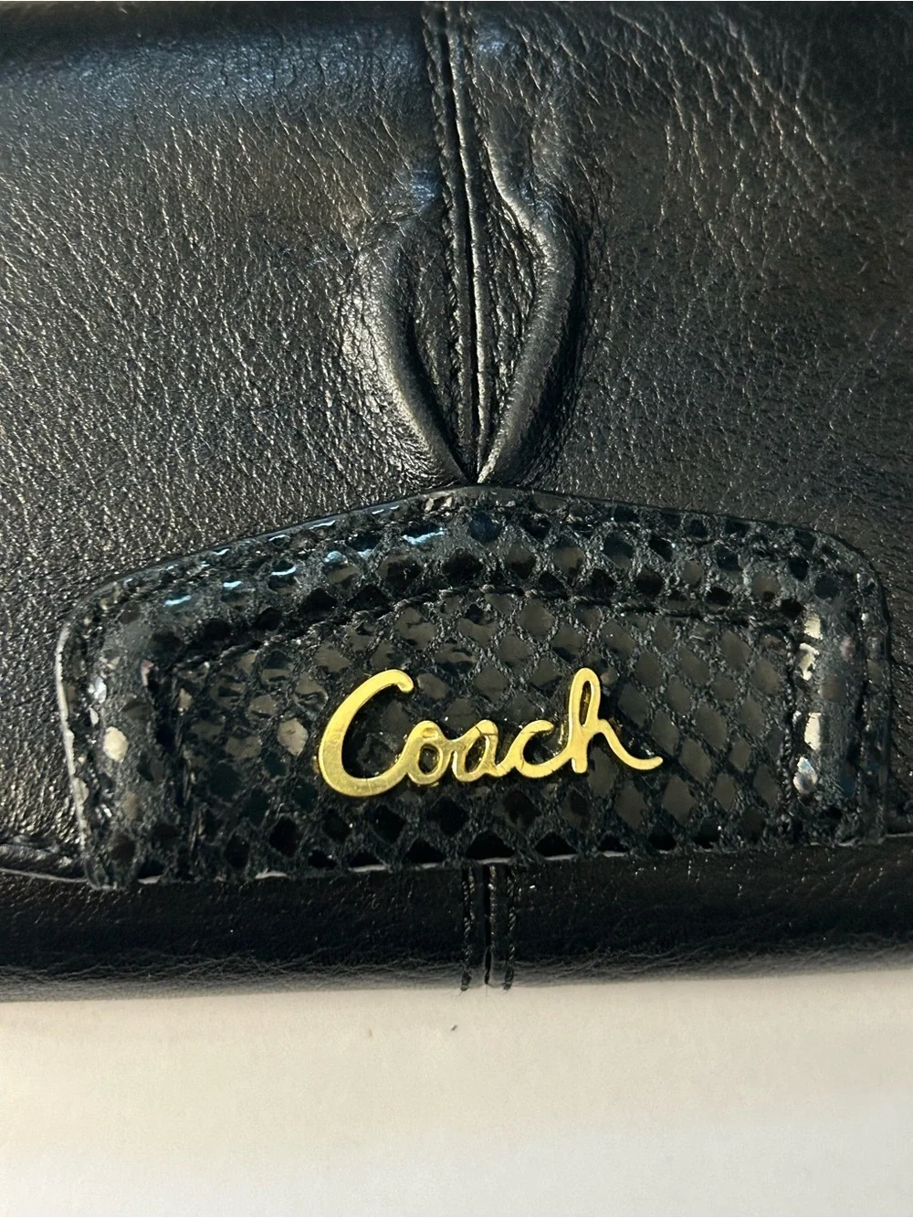 Coach Women’s Black Tri-Fold Wallet with Gold Script Logo